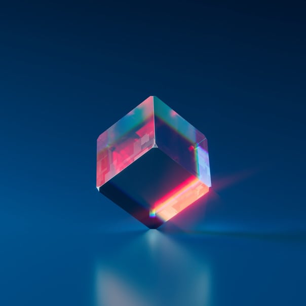 multicolor cube balanced on one corner